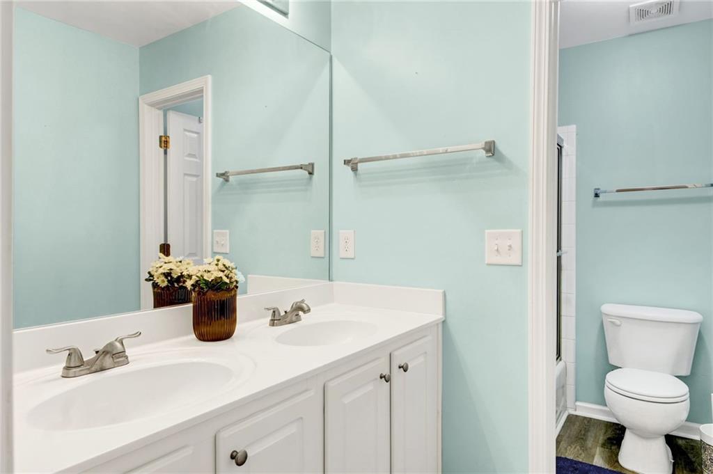 105 Fate Court Dallas, GA 30157 - Photo 27 of 32 a bathroom with a sink and a mirror
