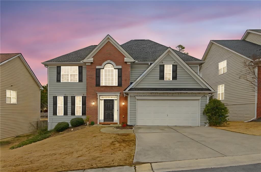 105 Fate Court Dallas, GA 30157 - Photo 3 of 32 a front view of a house with a garden
