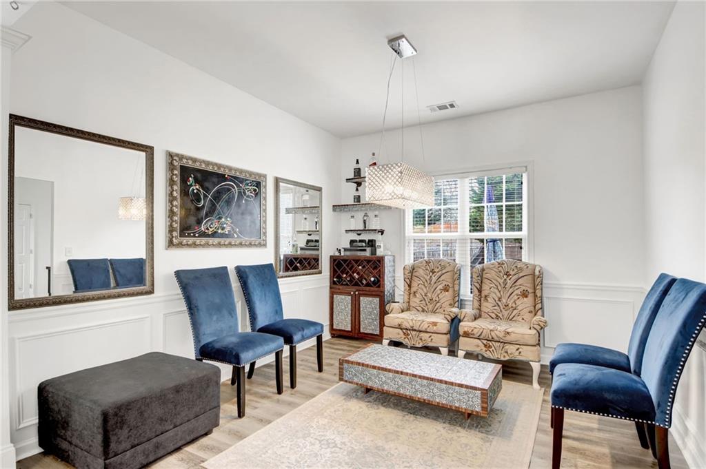 105 Fate Court Dallas, GA 30157 - Photo 7 of 32 a living room with furniture and a chandelier