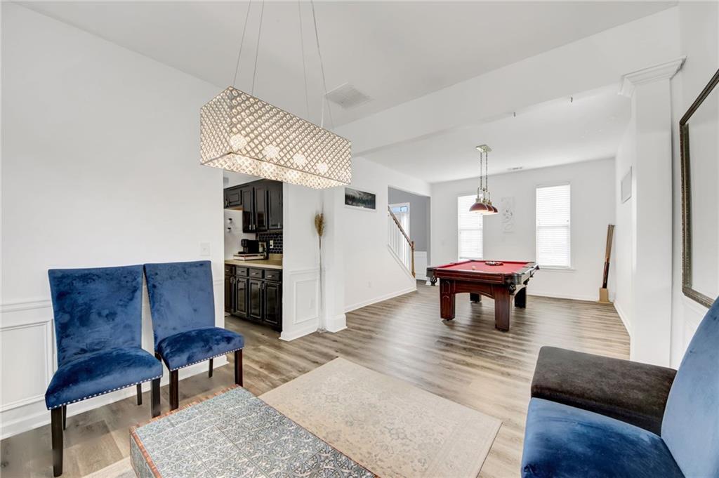 105 Fate Court Dallas, GA 30157 - Photo 8 of 32 a living room with furniture and a wooden floor