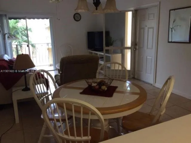 a kitchen with a table and chairs