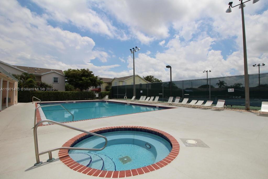 653 Waterside Drive, Unit 653 Hypoluxo, FL 33462 - Photo 10 of 12 a view of swimming pool with outdoor seating