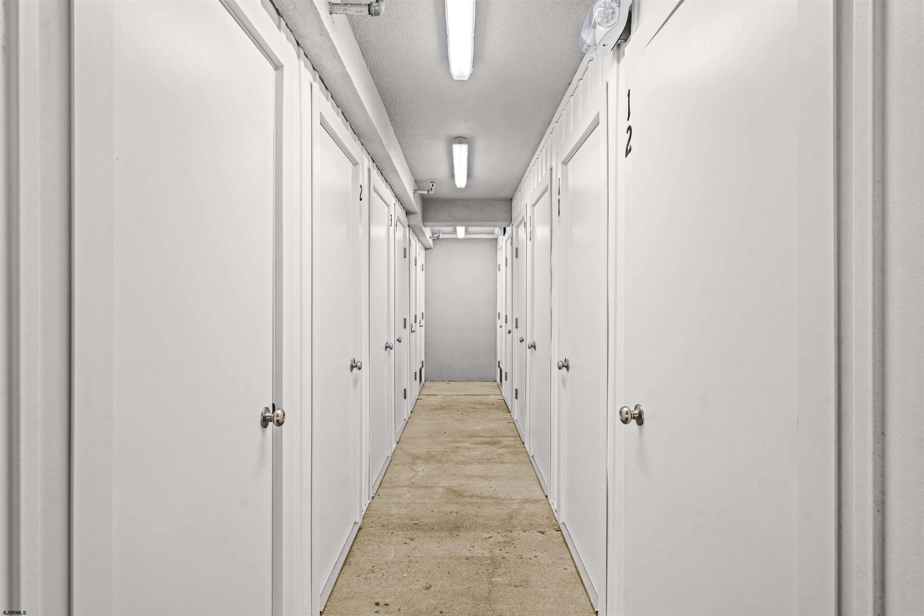 321 6th Street South, Unit 14 Brigantine, NJ 08203 - Photo 18 of 21 a view of a hallway with wooden floor and entryway