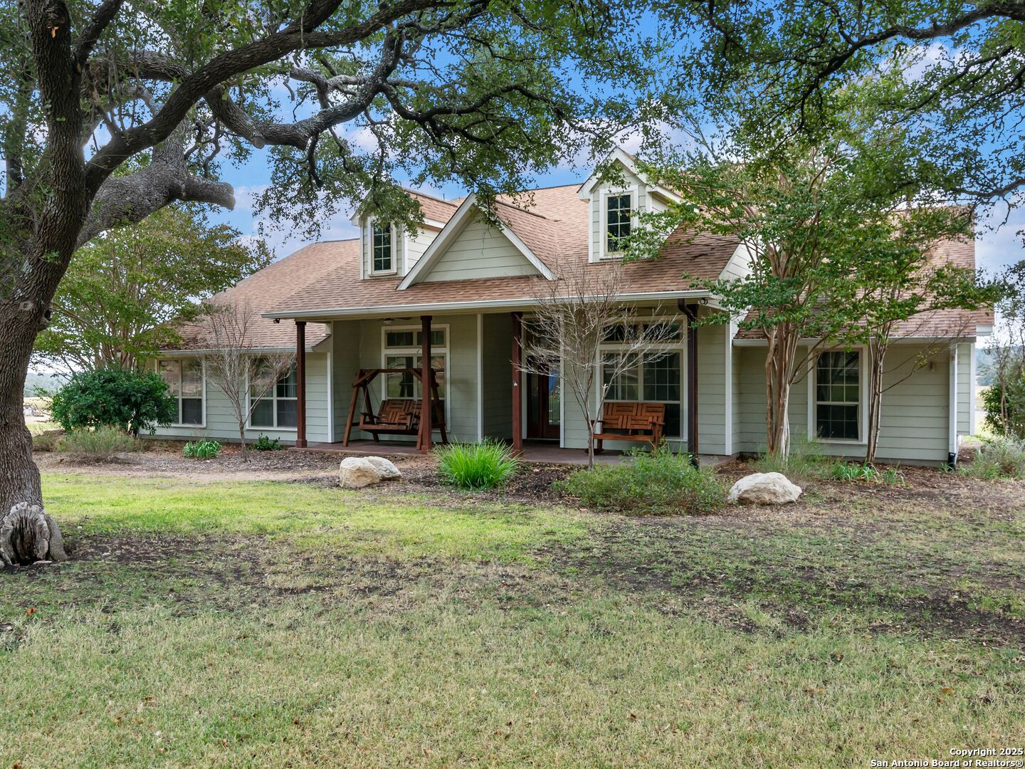 272 Schaper Road Fredericksburg, TX 78624 - Photo 1 of 62 a front view of a house with garden and porch
