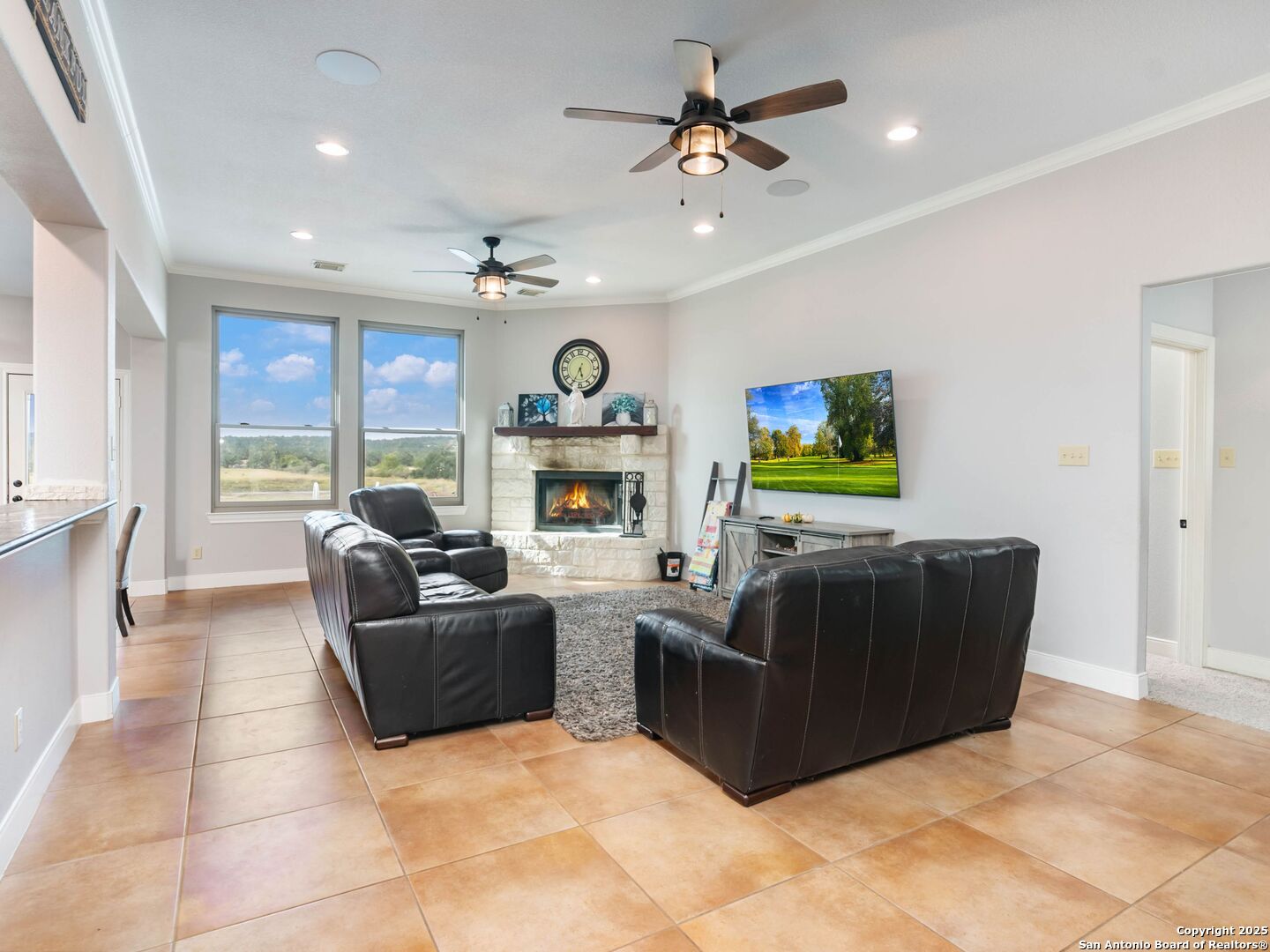 272 Schaper Road Fredericksburg, TX 78624 - Photo 13 of 62 a living room with furniture and a flat screen tv