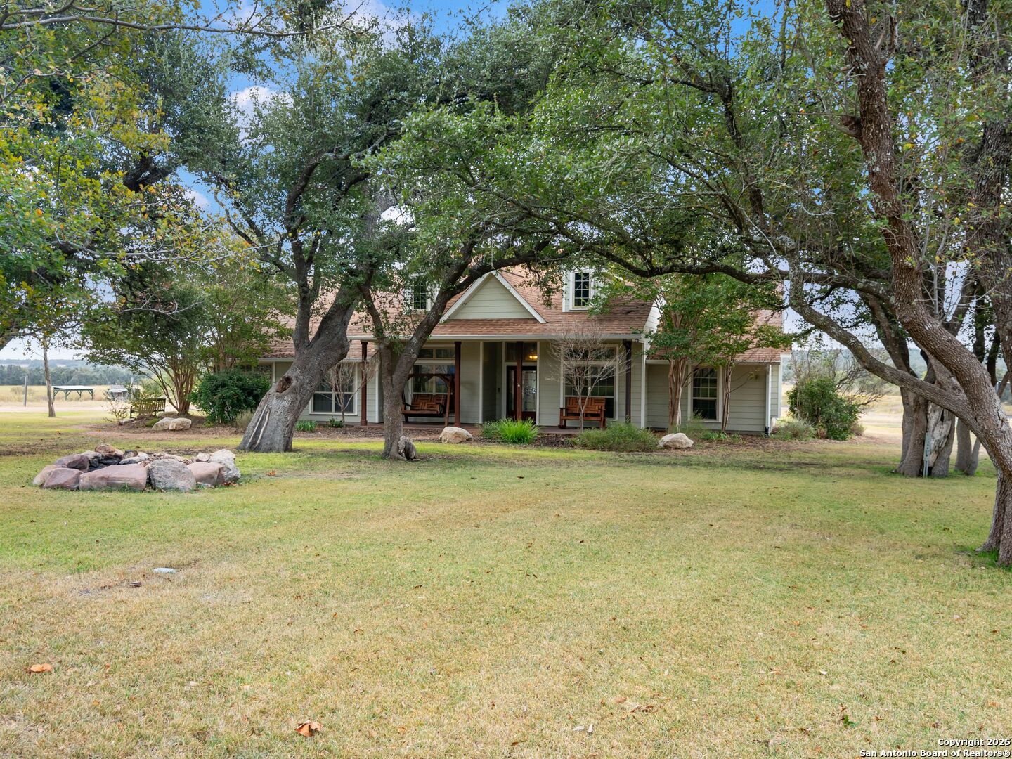 272 Schaper Road Fredericksburg, TX 78624 - Photo 2 of 62 a front view of a house with swimming pool having outdoor seating