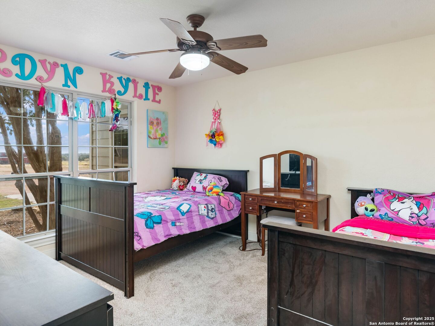 272 Schaper Road Fredericksburg, TX 78624 - Photo 29 of 62 a bedroom with furniture a baby bed baby crib and a dresser