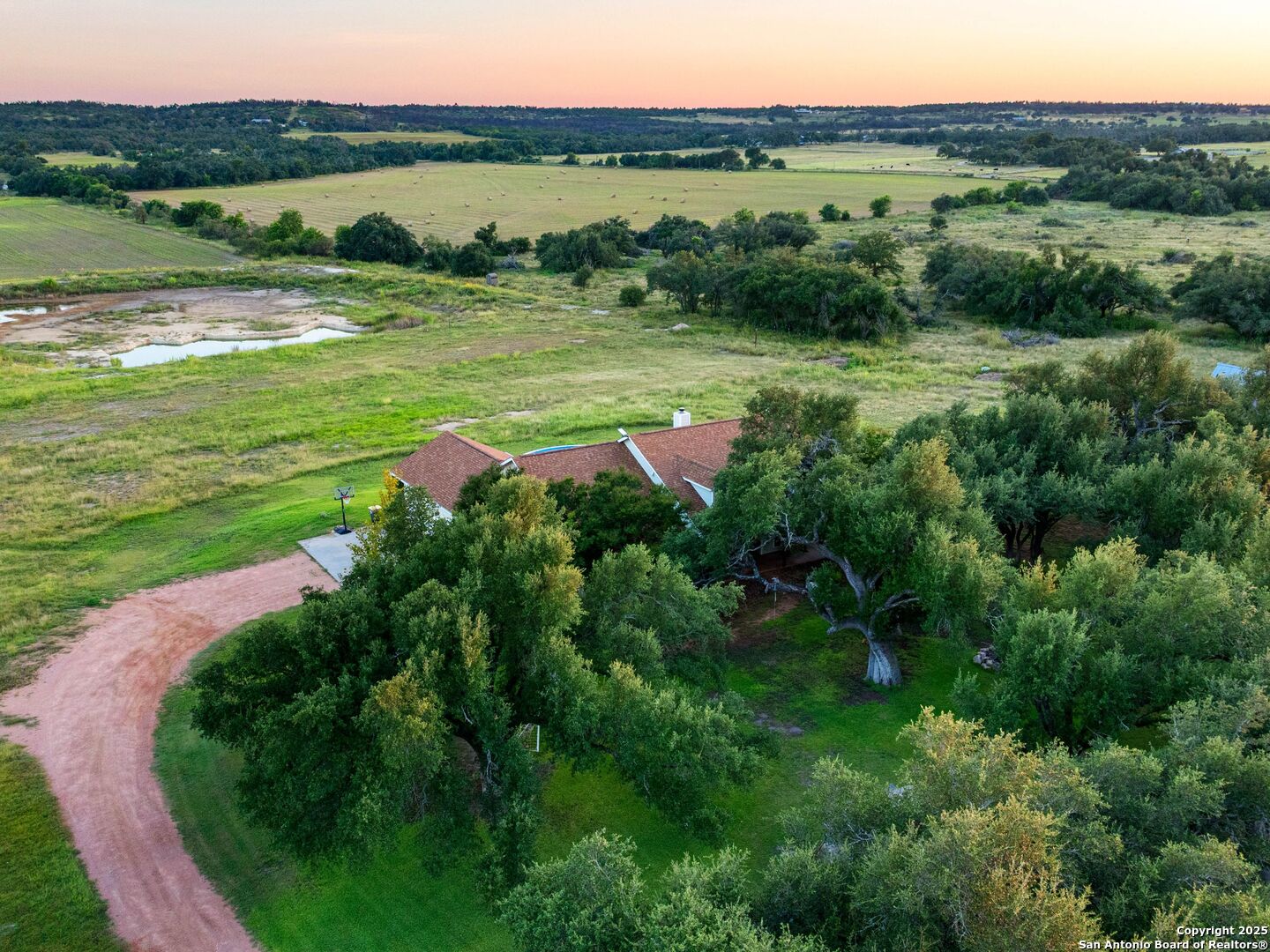 272 Schaper Road Fredericksburg, TX 78624 - Photo 57 of 62 a view of a lush green outdoor space with a lake view and mountain view