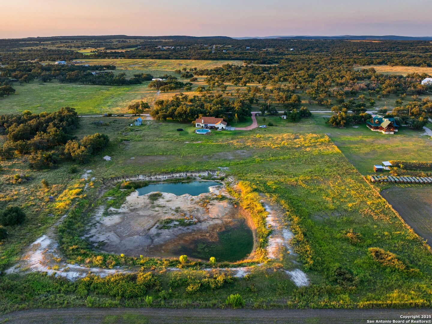 272 Schaper Road Fredericksburg, TX 78624 - Photo 60 of 62 a view of a lake with a yard