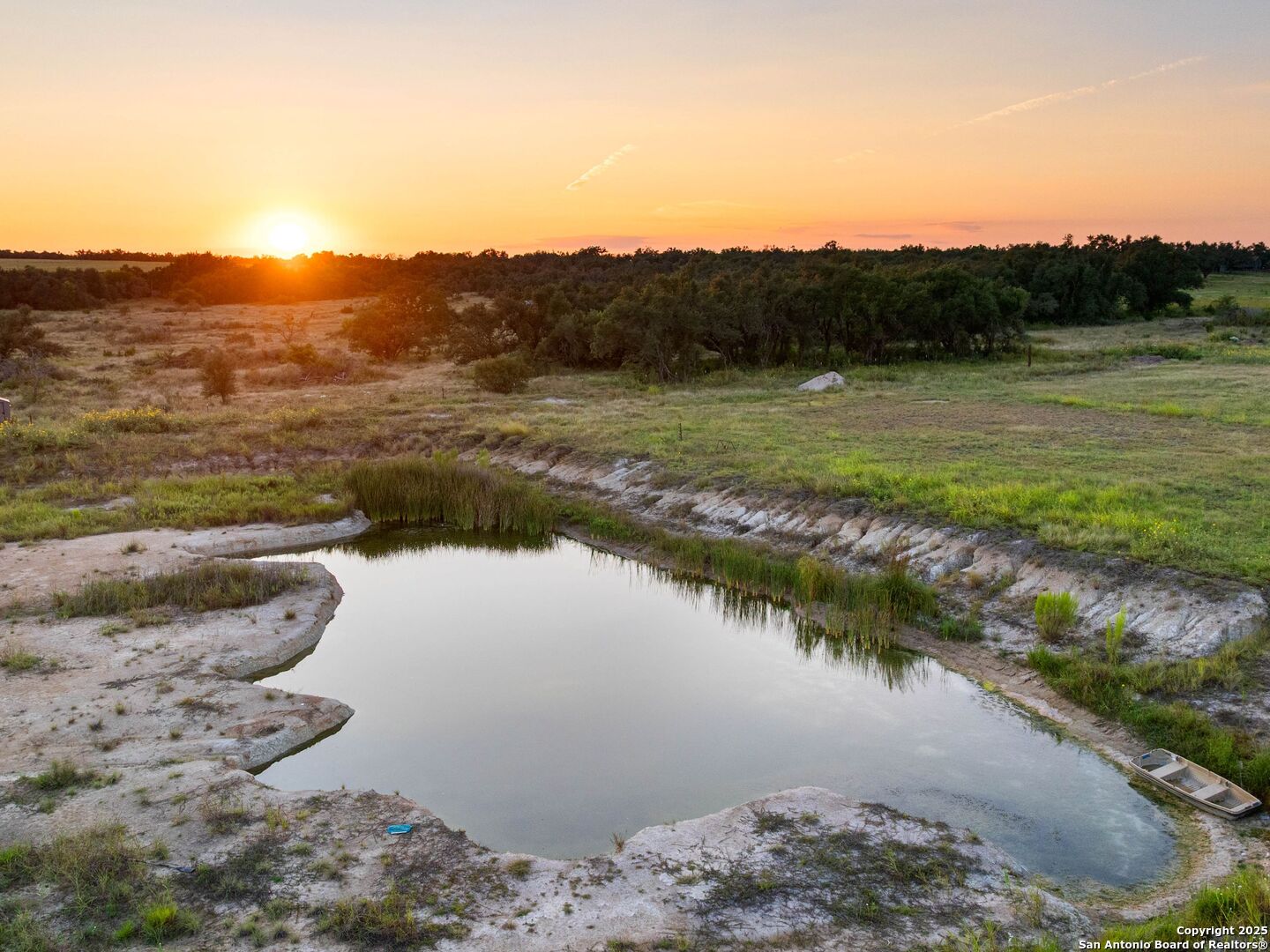 272 Schaper Road Fredericksburg, TX 78624 - Photo 62 of 62 a view of a lake with a mountain in the background
