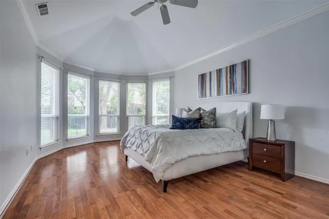 a kitchen with granite countertop a refrigerator sink and cabinets