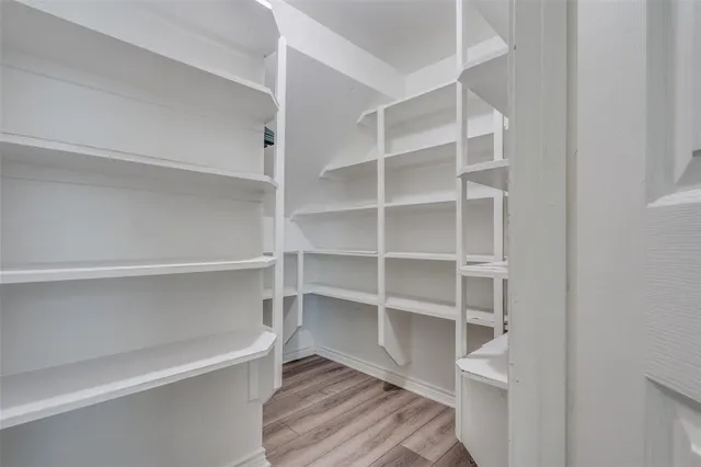 a view of an empty walk in closet