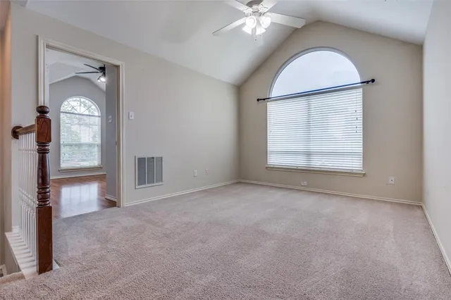 a view of an empty room with stairs