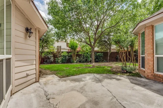 a view of a back yard of the house