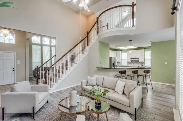 a view of entryway with wooden floor and stairs