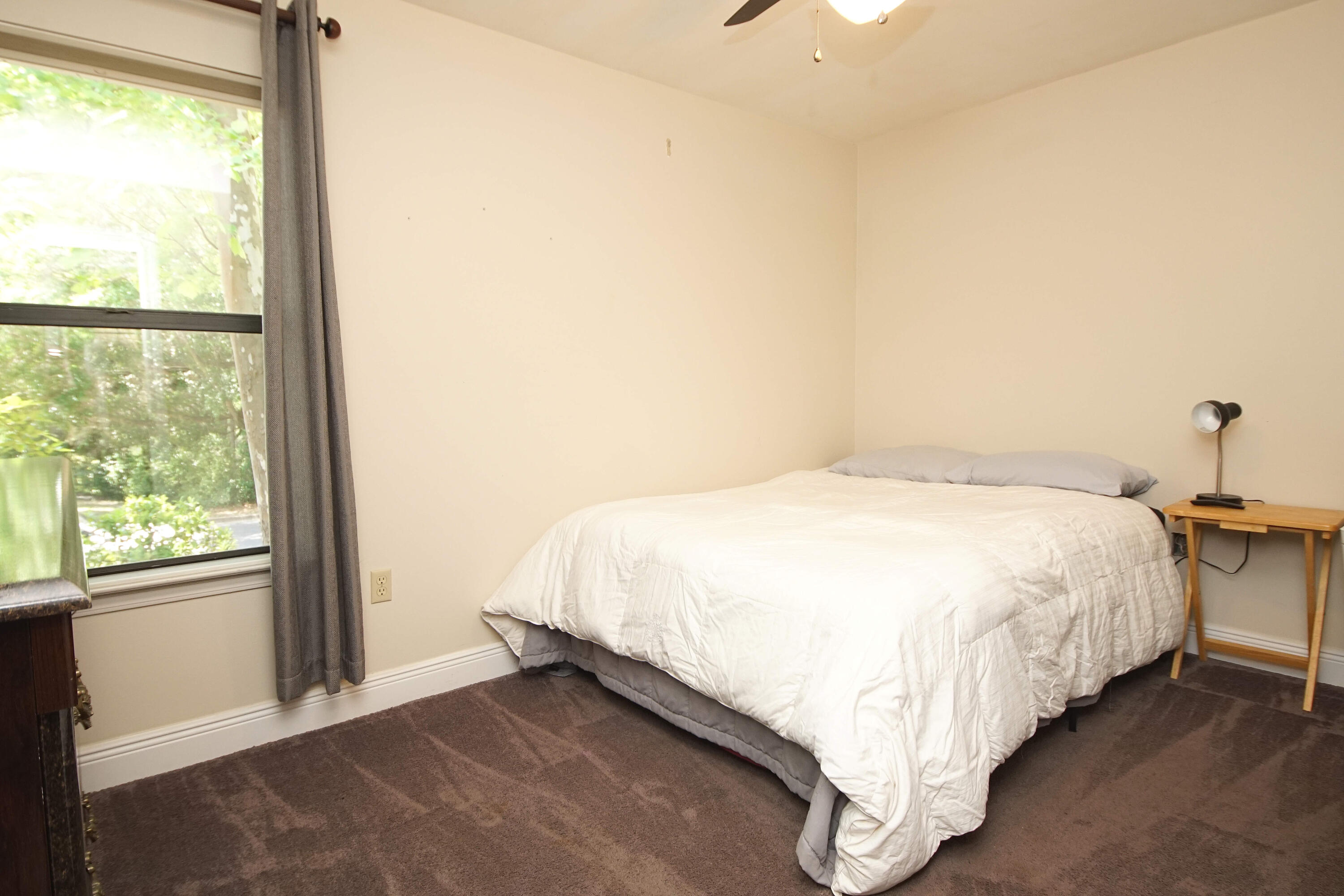 250 Panama Drive Crestview, FL 32536 - Photo 11 of 20 a bed sitting in a bedroom next to a window