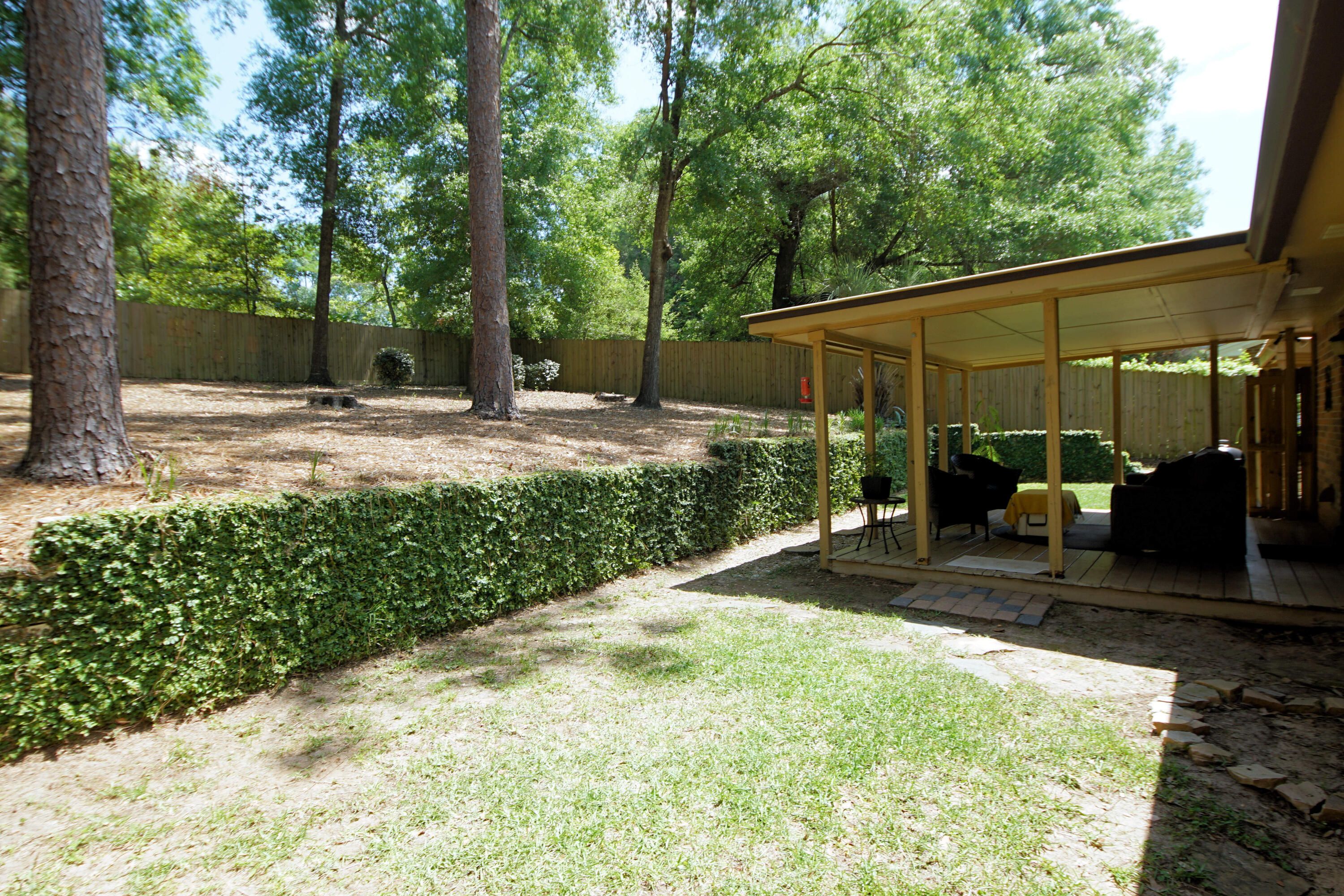 250 Panama Drive Crestview, FL 32536 - Photo 15 of 20 a view of a backyard with sitting area