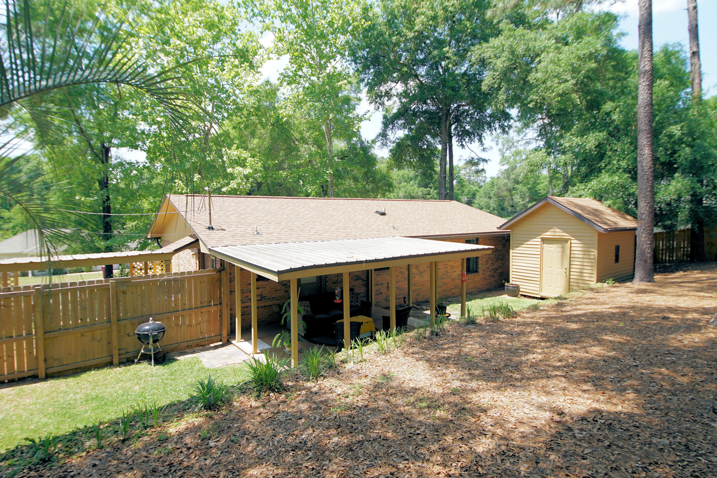 250 Panama Drive Crestview, FL 32536 - Photo 17 of 20 a view of a house with a yard and large trees