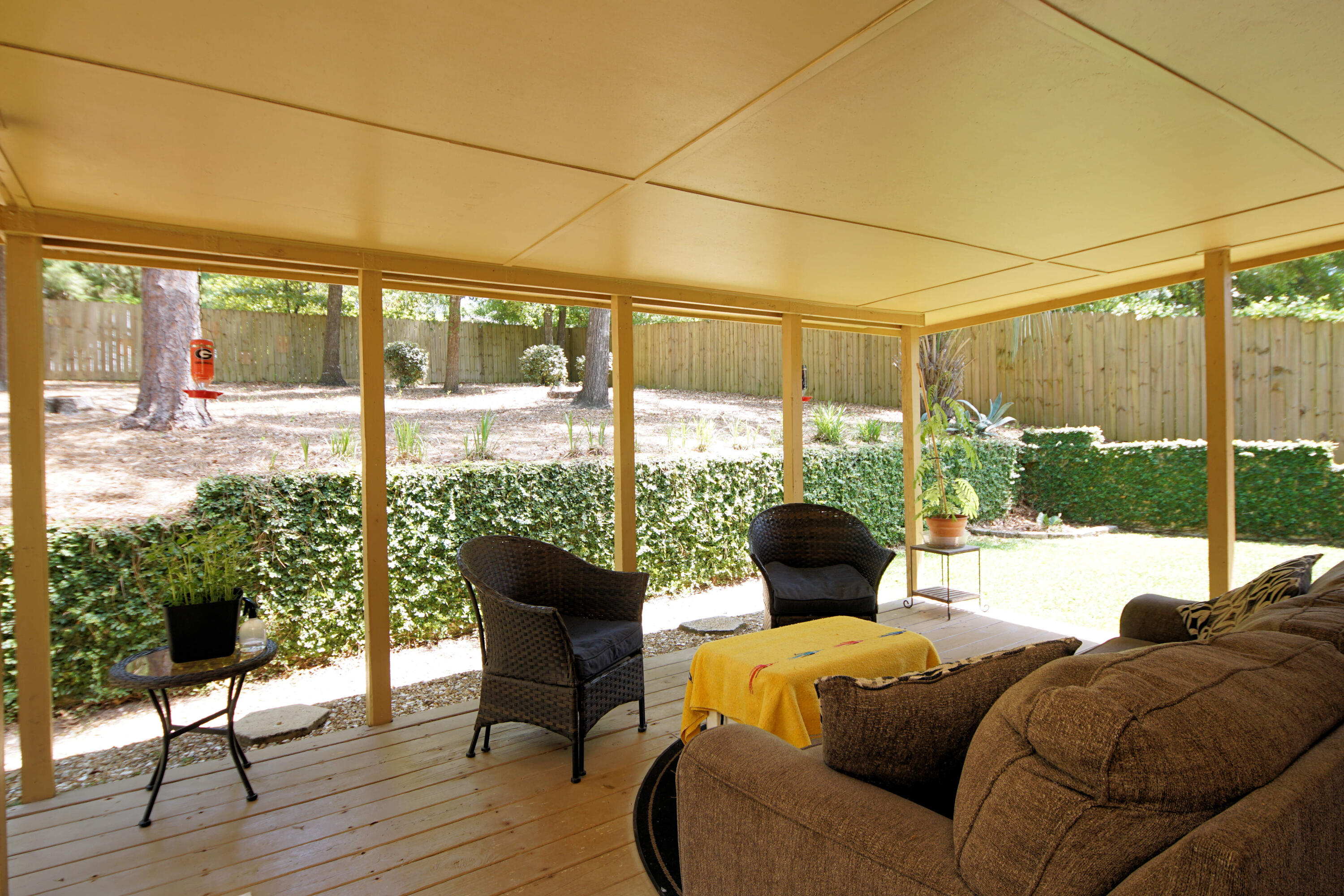 250 Panama Drive Crestview, FL 32536 - Photo 18 of 20 a living room with furniture and a floor to ceiling window