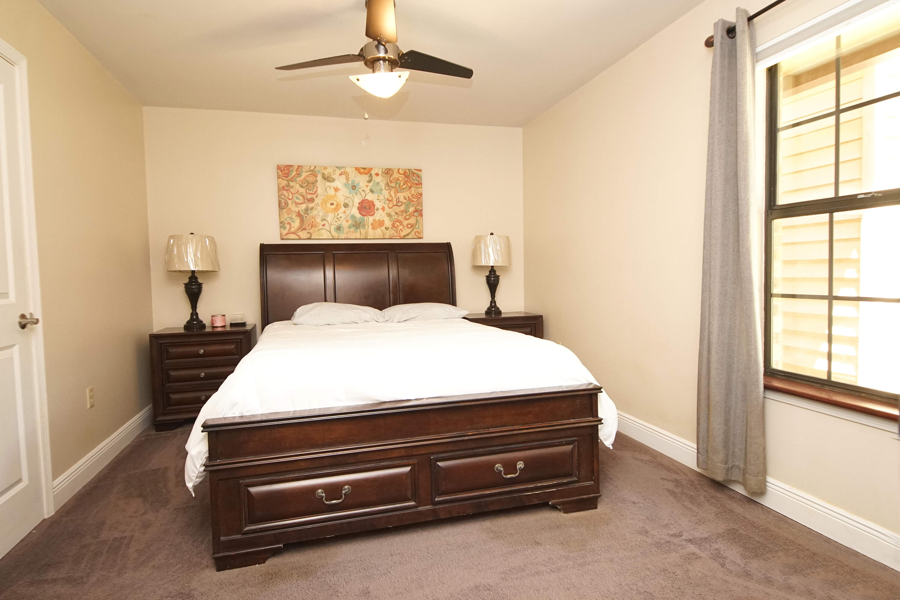 250 Panama Drive Crestview, FL 32536 - Photo 6 of 20 a bed sitting in a bedroom next to a window