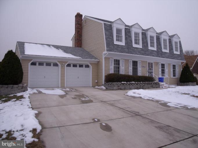 a front view of a house with yard