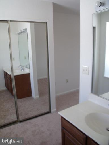2963 Gracefield Road Silver Spring, MD 20904 - Photo 13 of 30 a bathroom with a sink and a mirror