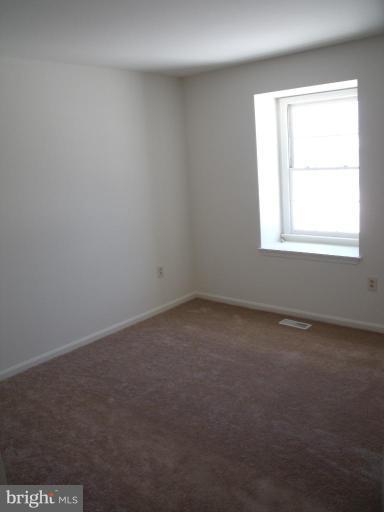 2963 Gracefield Road Silver Spring, MD 20904 - Photo 15 of 30 an empty room with a window