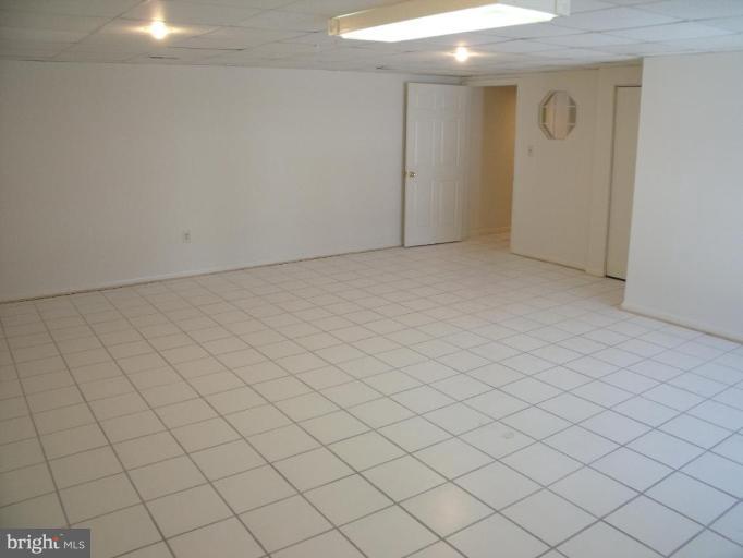 2963 Gracefield Road Silver Spring, MD 20904 - Photo 19 of 30 an empty room with windows