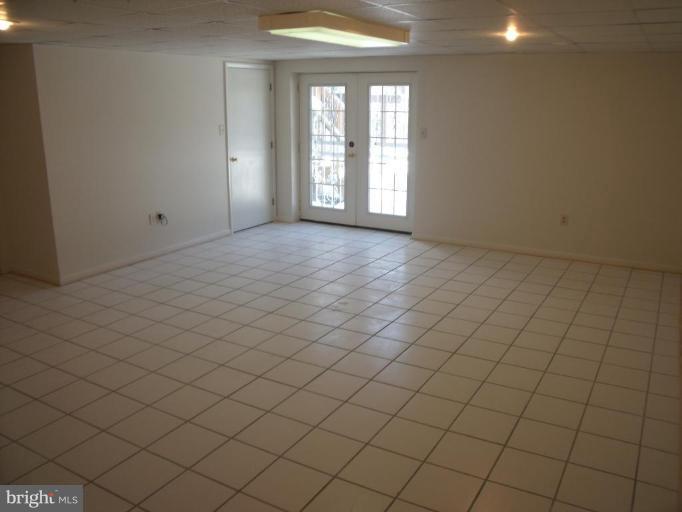 2963 Gracefield Road Silver Spring, MD 20904 - Photo 20 of 30 an empty room with windows