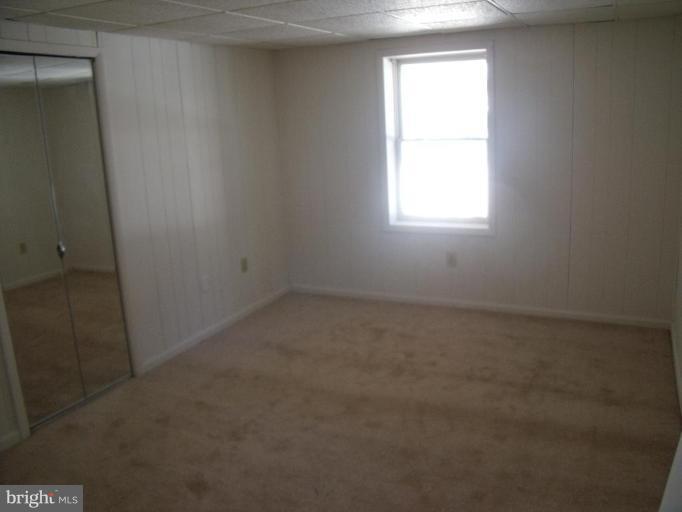 2963 Gracefield Road Silver Spring, MD 20904 - Photo 22 of 30 an empty room with a window