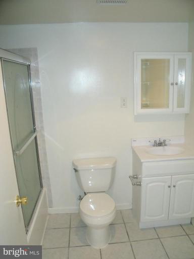 2963 Gracefield Road Silver Spring, MD 20904 - Photo 23 of 30 a bathroom with a toilet sink and a mirror