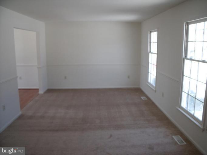 2963 Gracefield Road Silver Spring, MD 20904 - Photo 25 of 30 an empty room with windows