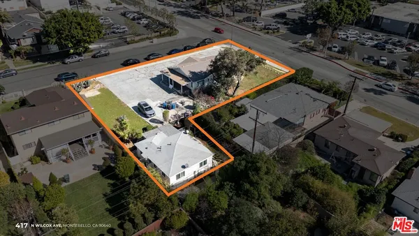 an aerial view of house with yard