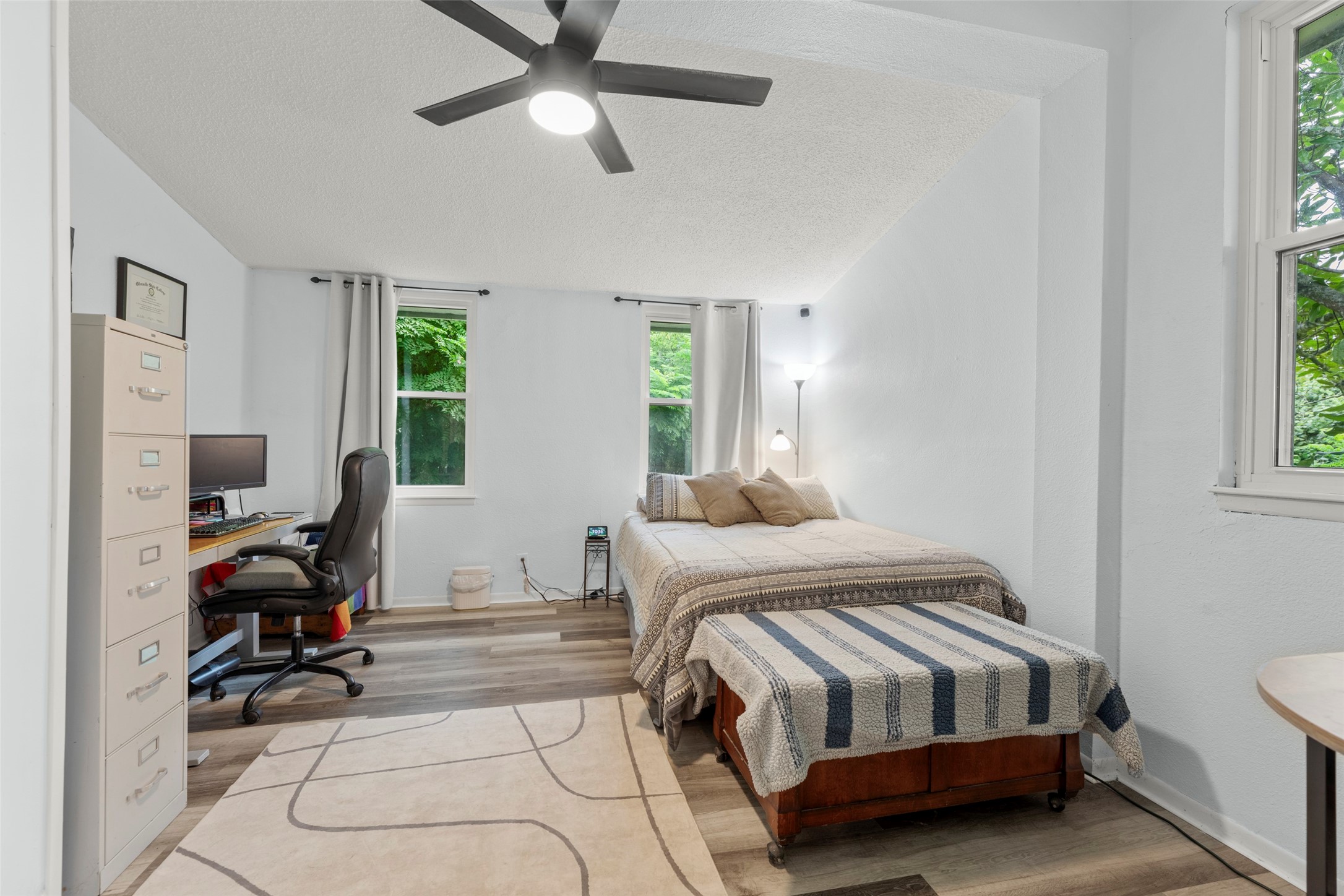 703 Pecan Valley Road Wharton, TX 77488 - Photo 19 of 47 As you can see, the guest bedroom offers plenty of room for your guest bed as well as a nice office space. Multiple windows allow for beautiful river views and tons of natural light to flood this room.