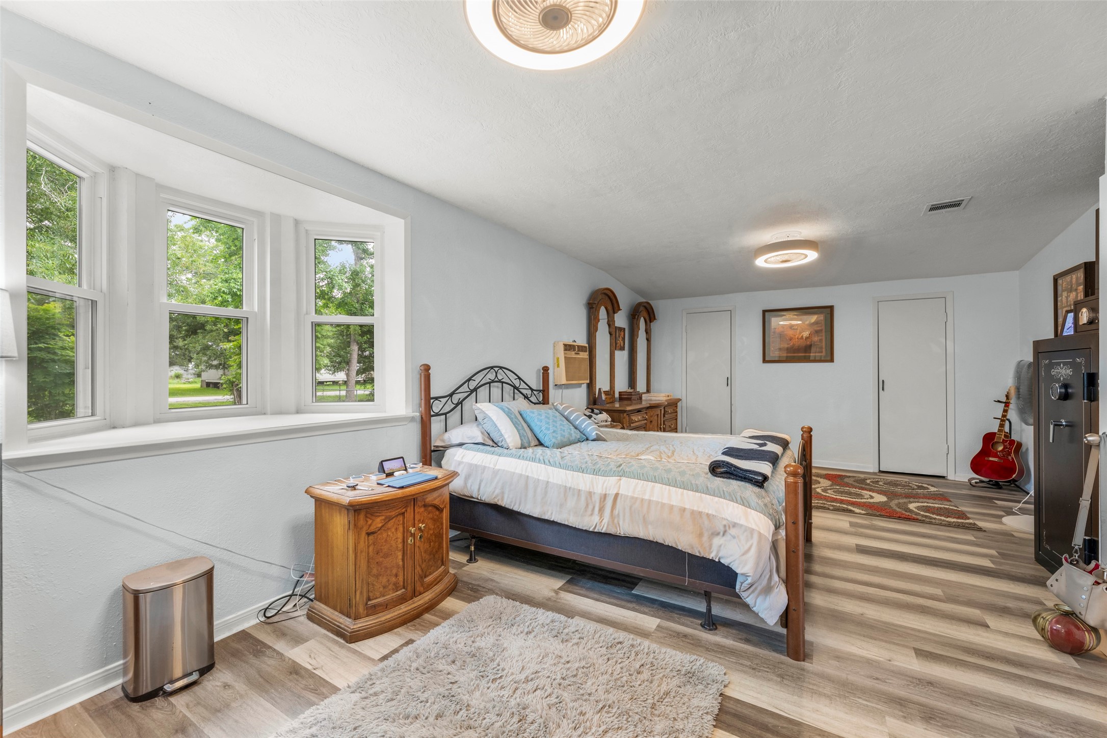 703 Pecan Valley Road Wharton, TX 77488 - Photo 21 of 47 This primary bedroom allows for plenty of space to create a separate sitting area. Double closets offer ample space for your clothing.