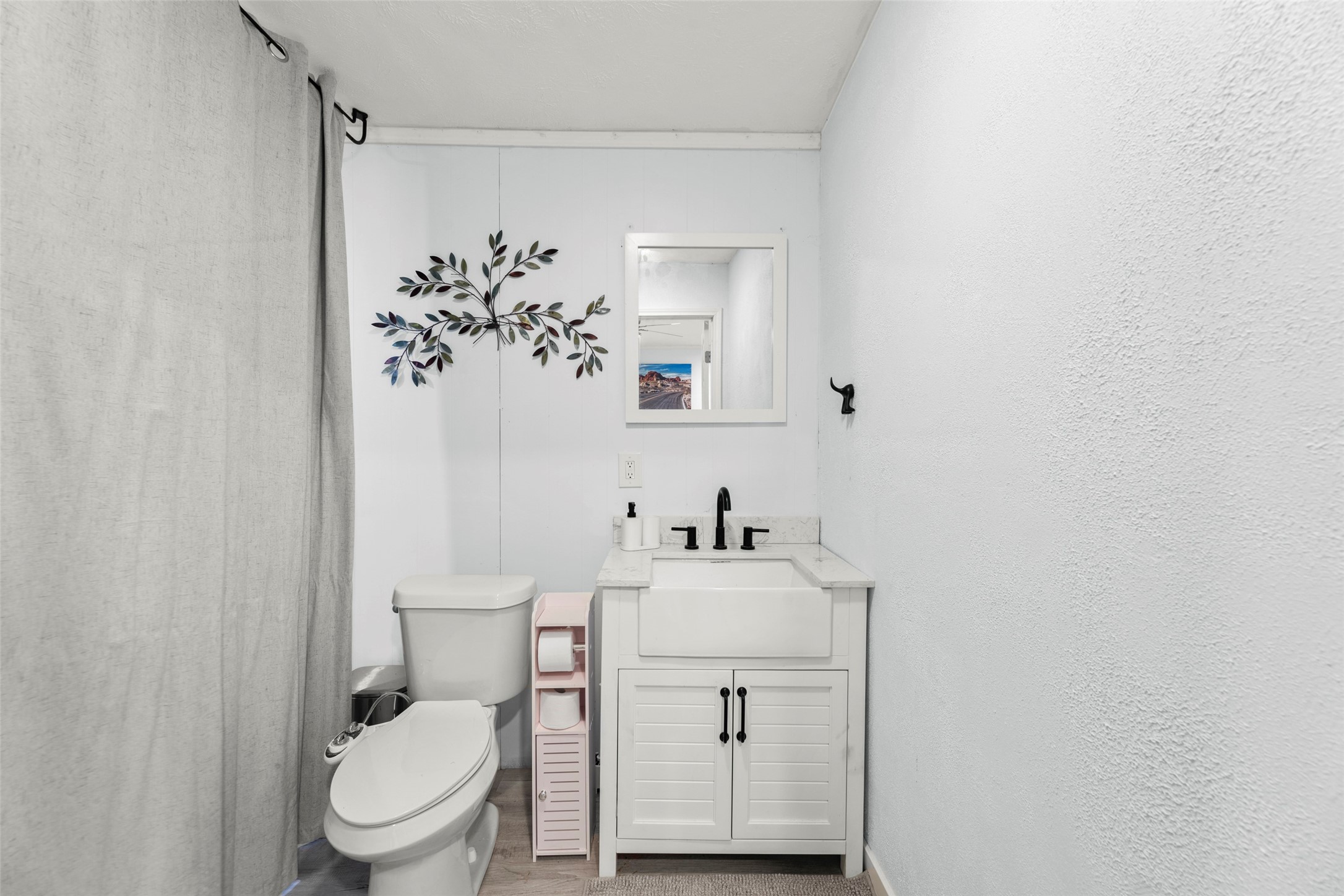 703 Pecan Valley Road Wharton, TX 77488 - Photo 10 of 47 Half bath is located just off of the family room. To the left, conveniently located behind the privacy curtain, you'll find the in-home laundry area.