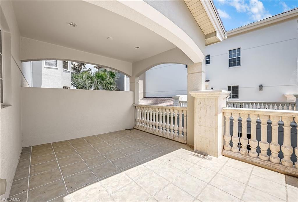 510 Avellino Isles Circle, Unit 2202 Naples, FL 34119 - Photo 22 of 35 a view of a porch with wooden floor
