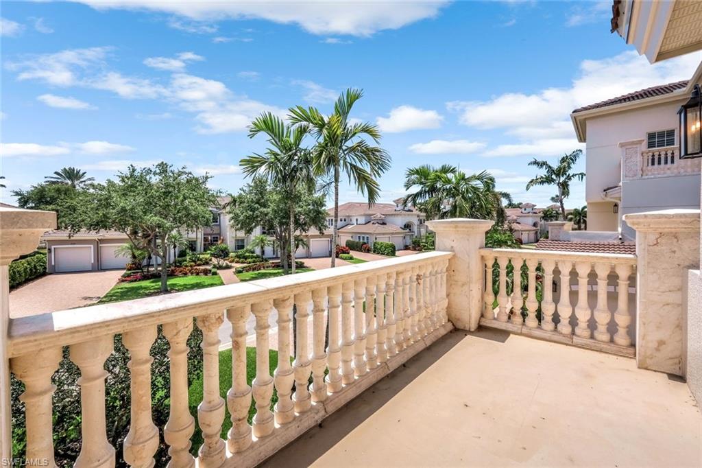 510 Avellino Isles Circle, Unit 2202 Naples, FL 34119 - Photo 23 of 35 a view of a fence and a porch