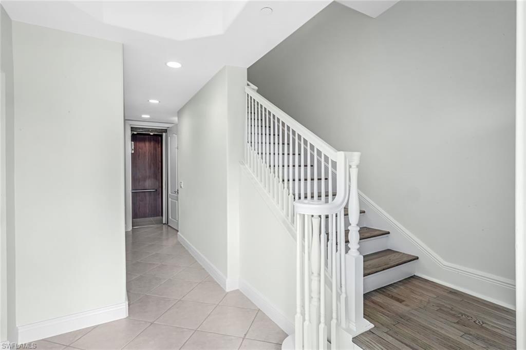 510 Avellino Isles Circle, Unit 2202 Naples, FL 34119 - Photo 4 of 35 a view of entryway and hall with wooden floor