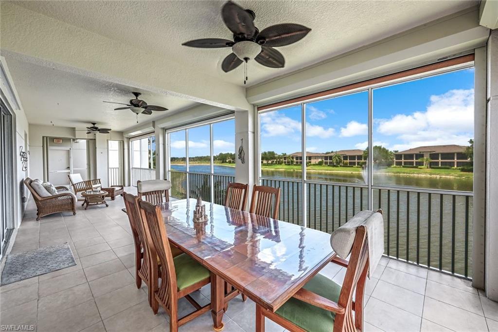 510 Avellino Isles Circle, Unit 2202 Naples, FL 34119 - Photo 9 of 35 a view of a dining room with furniture window and outside view