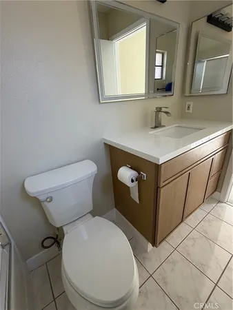 a picture of a room with a sink and a mirror