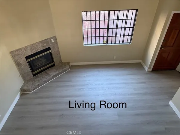 a view of an empty room with windows