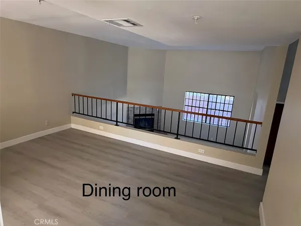 a view of staircase with wooden floor