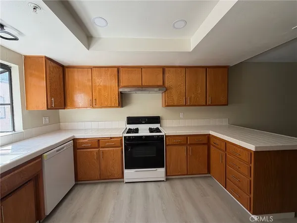 a kitchen with a sink and a stove top oven
