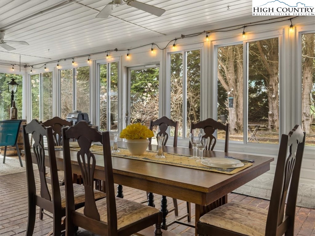 438 Glade Valley Road Glade Valley, NC 28627 - Photo 12 of 50 a view of a dining room with furniture window and outside view