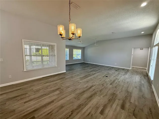 a view of an empty room with glass door