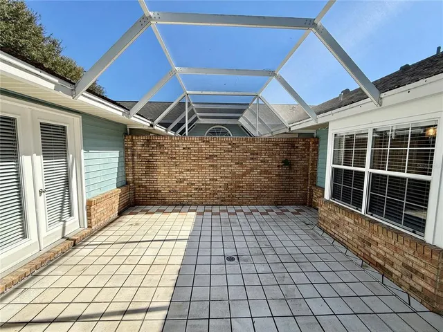 a kitchen with stainless steel appliances granite countertop a refrigerator a stove a sink and a microwave