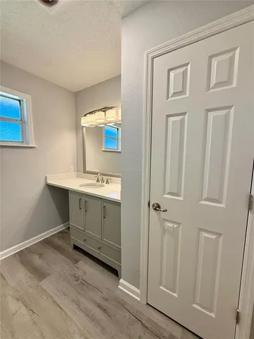 a view of a livingroom with an empty space and a window