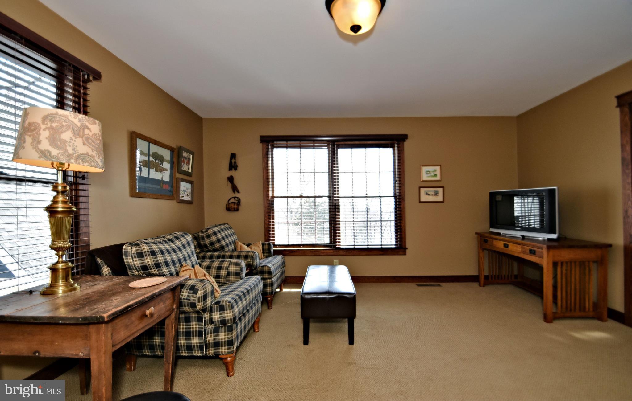 312 Ferry Road Doylestown, PA 18901 - Photo 20 of 66 a living room with furniture and a flat screen tv