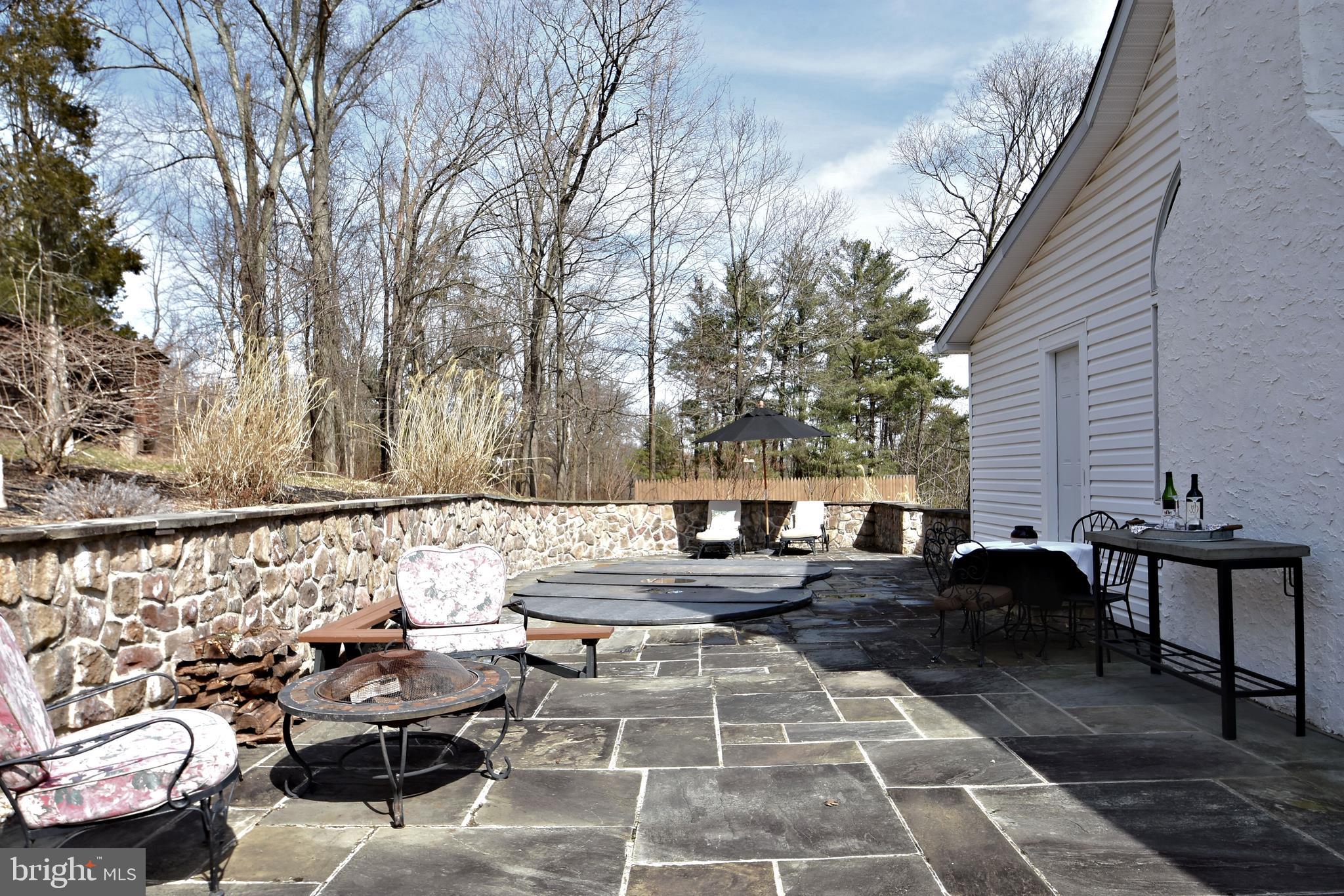 312 Ferry Road Doylestown, PA 18901 - Photo 55 of 66 a view of a patio with couches table and chairs and potted plants